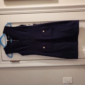 Dress. Sleeveless, textured tweed, soft fringe at neckline, sleeves & hem.